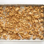 toasted oats on a baking sheet.