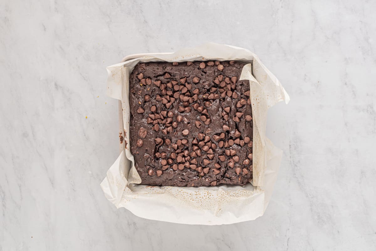 baked avocado brownies in a square baking pan.