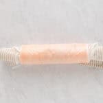 strawberry cake rolled up in a towel.