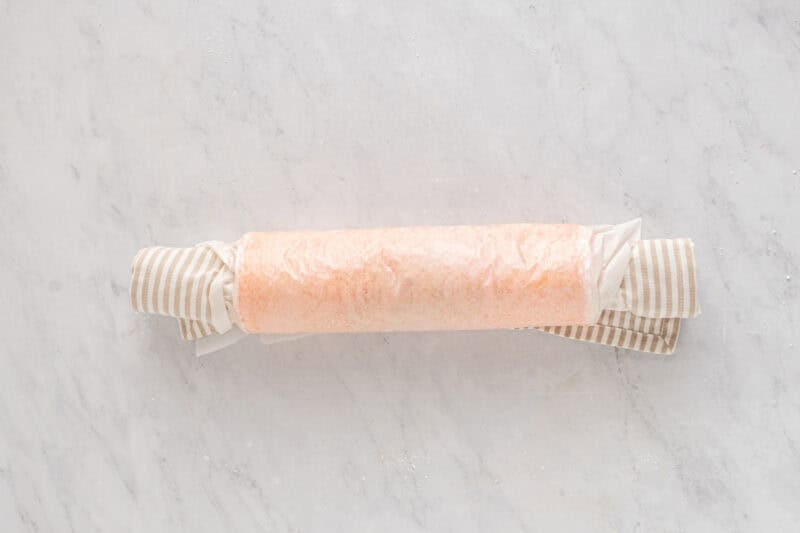 strawberry cake rolled up in a towel.