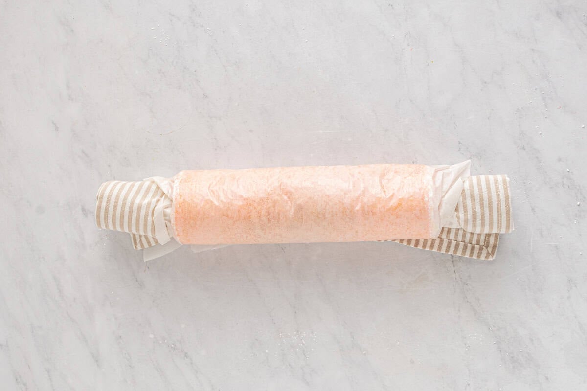 strawberry cake rolled up in a towel.