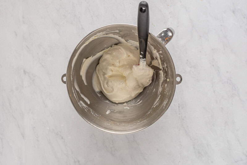 folding cool whip into beaten cream cheese with a rubber spatula.