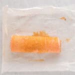 strawberry cake filled with cream cheese and strawberries, and rolled into a log.