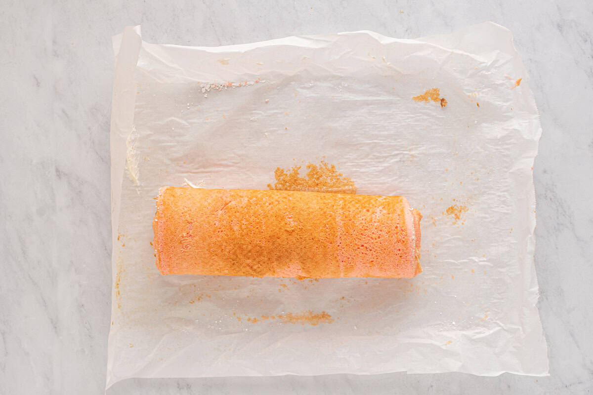 strawberry cake filled with cream cheese and strawberries, and rolled into a log.