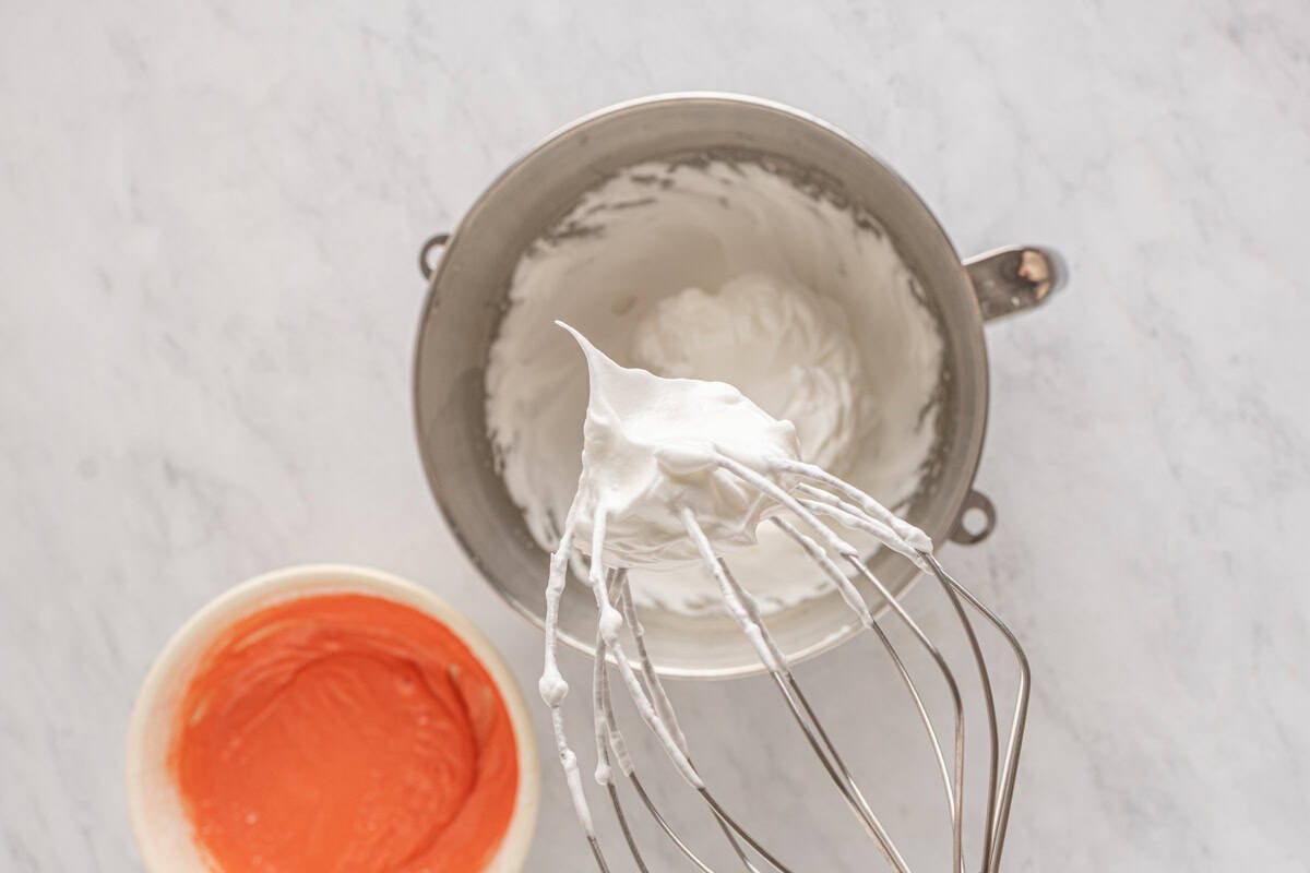 whipped meringue on a stand mixer whisk.