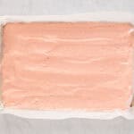 strawberry cake batter in a baking pan.