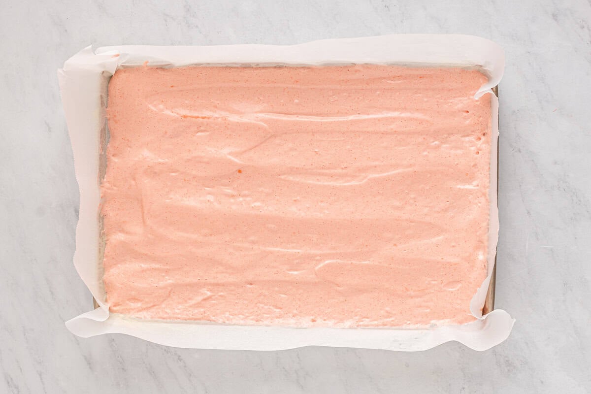 strawberry cake batter in a baking pan.