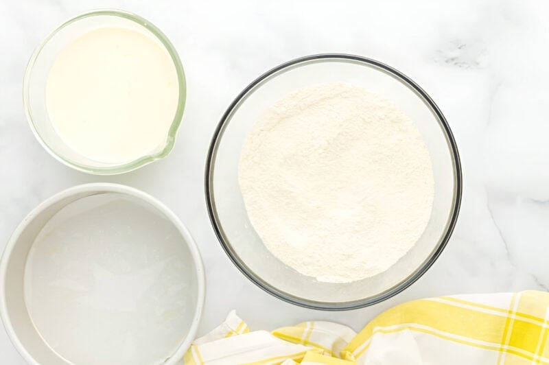 dry ingredients for lemon cake in a glass bowl.