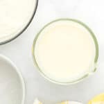 wet ingredients for lemon cake in a glass bowl.
