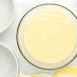 thick lemon cake batter in a glass bowl.