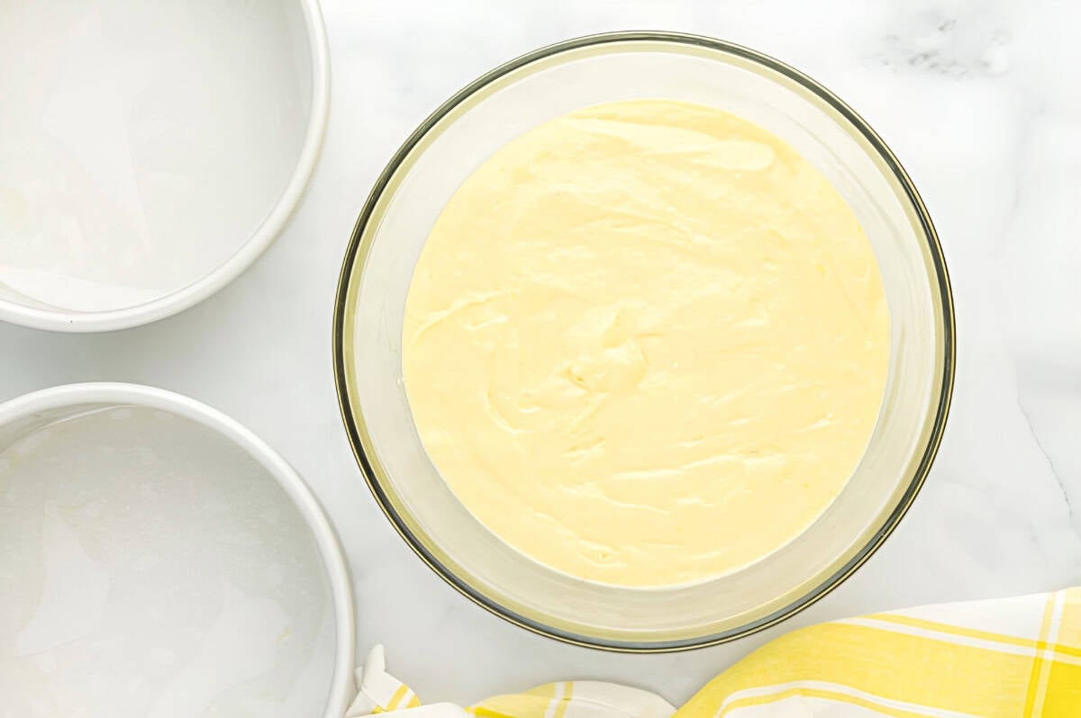 thick lemon cake batter in a glass bowl.