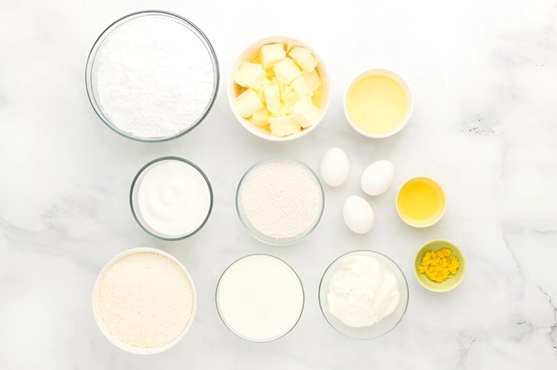 ingredients for moist lemon cake in individual bowls.