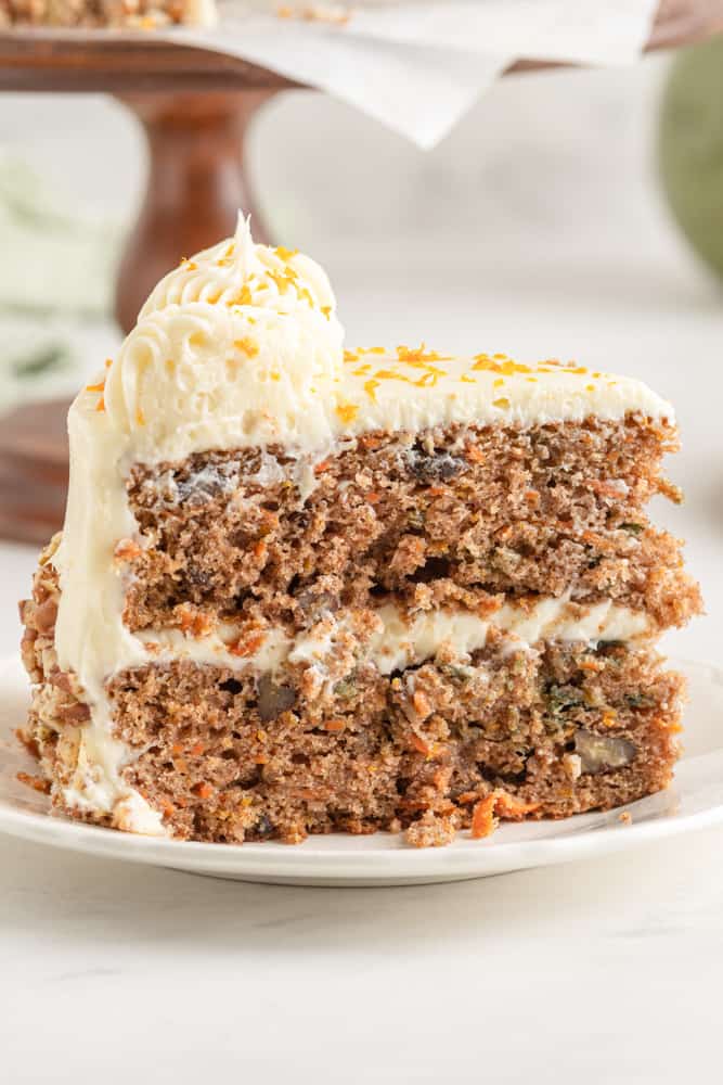 a slice of orange carrot cake viewed from the side