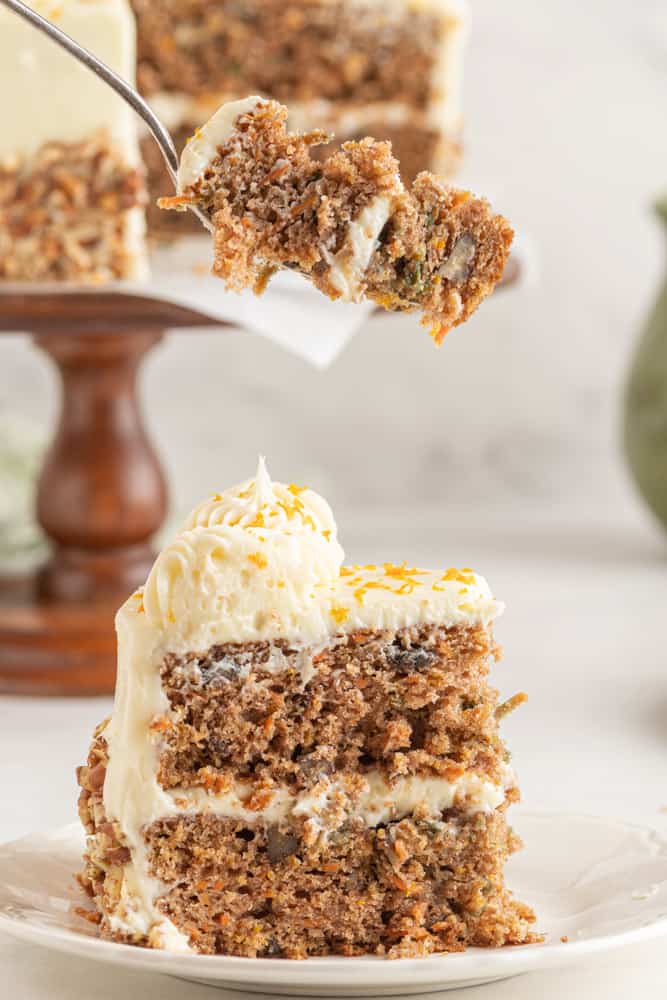 slice of spiced orange carrot cake on a plate