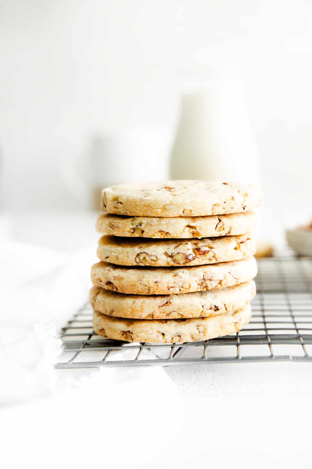 a stack of pecan shortbread cookies viewed from the side