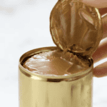 opening a sealed can of dulce de leche.