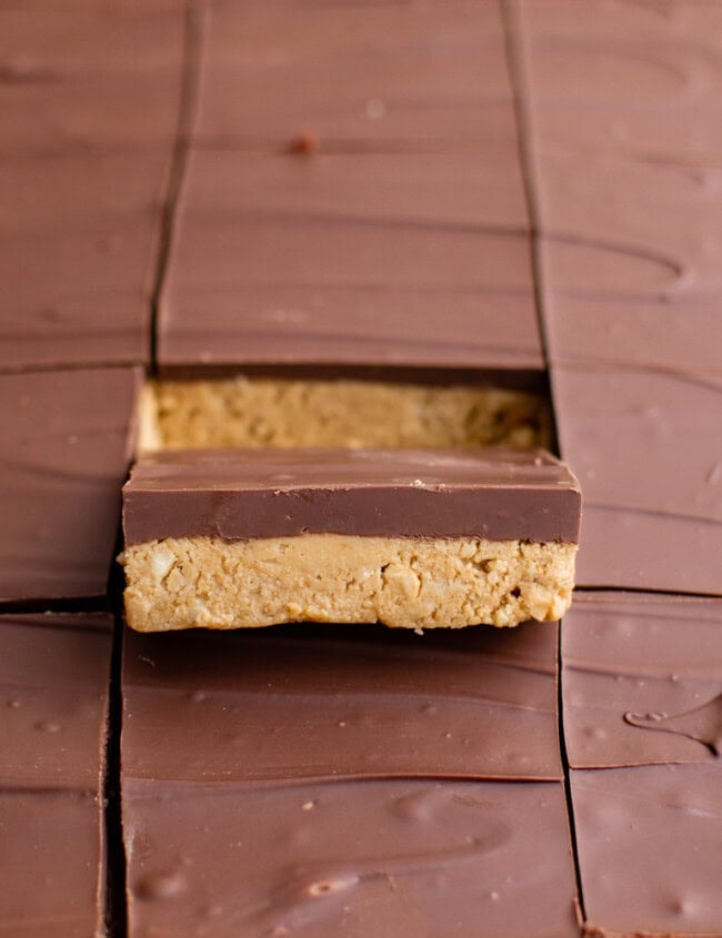 peanut butter bars with a bite taken out of them.