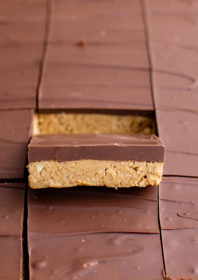 peanut butter bars with a bite taken out of them.