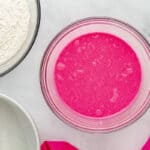 neon pink liquid in a glass bowl.