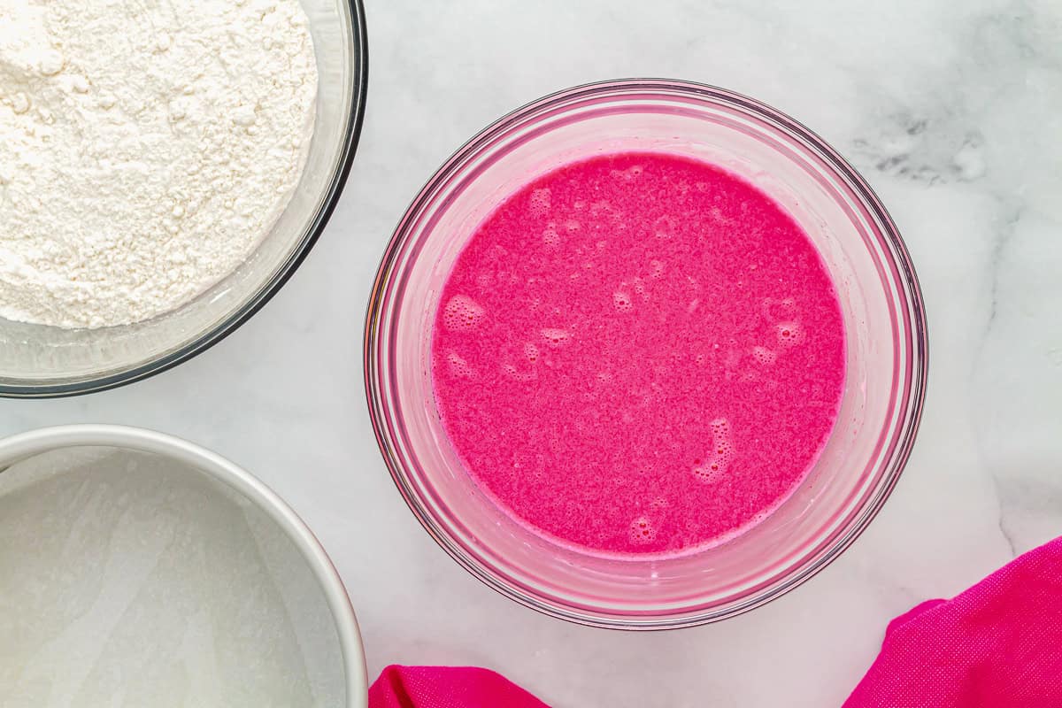 neon pink liquid in a glass bowl.