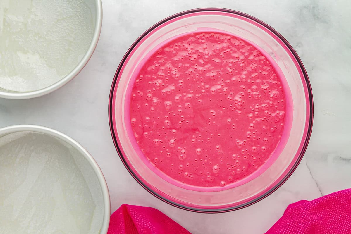 pink velvet cake batter in a glass bowl.