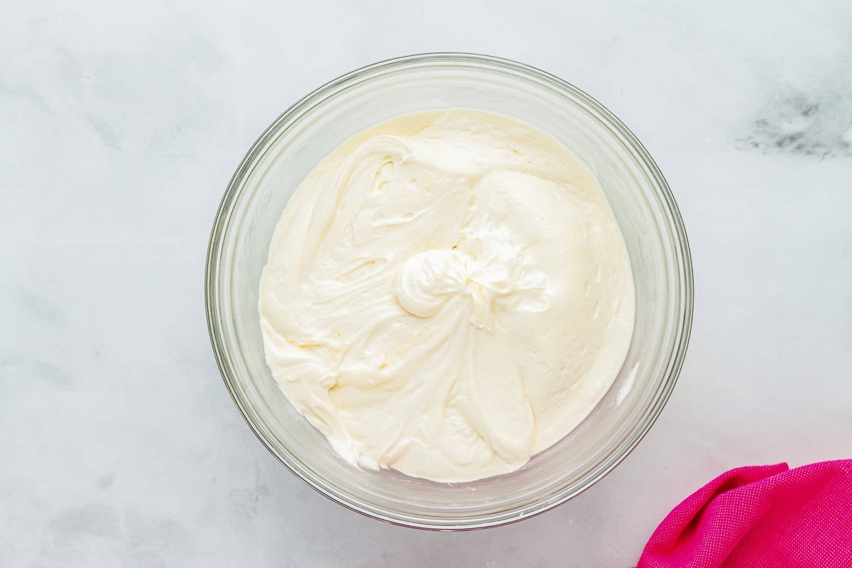 cream cheese frosting in a glass bowl.