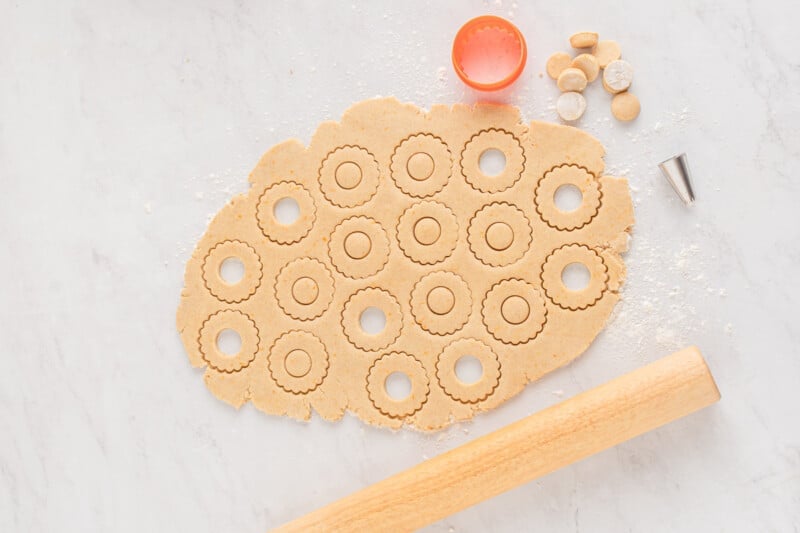 cutting wreath shapes out of the cookie dough
