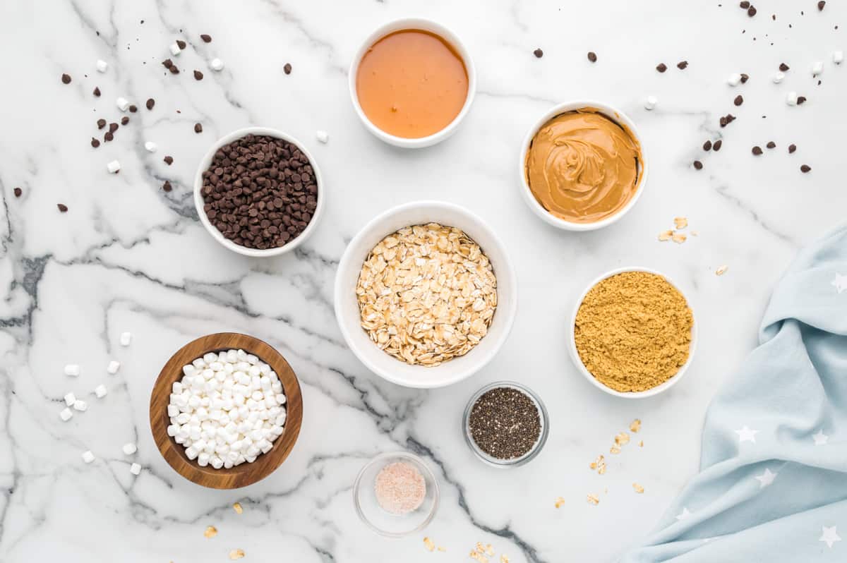 overhead view of ingredients for s'mores energy bites in individual bowls.