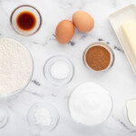 measured ingredients for snickerdoodle cupcakes in individual bowls.