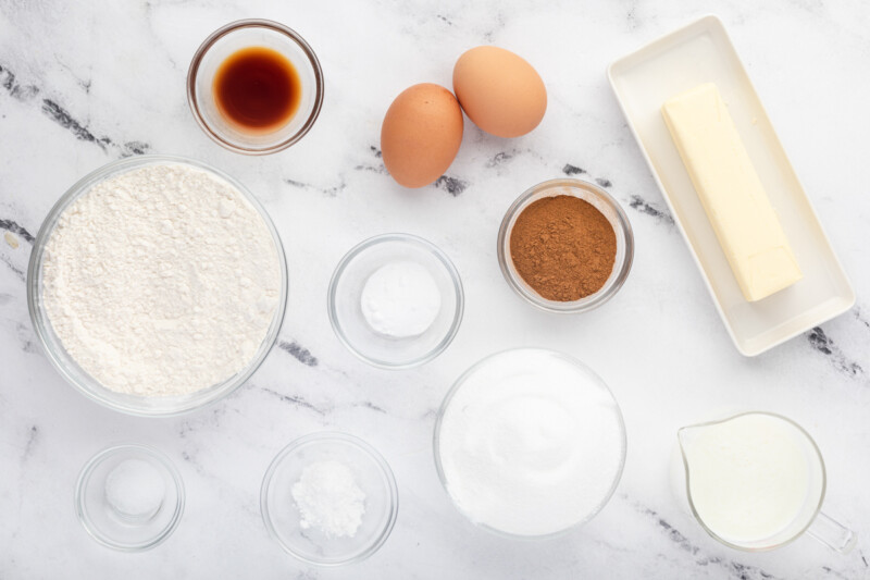 measured ingredients for snickerdoodle cupcakes in individual bowls.