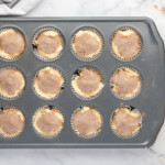 unbaked snickerdoodle cupcakes in a cupcake tin.