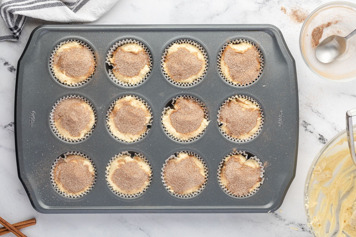unbaked snickerdoodle cupcakes in a cupcake tin.