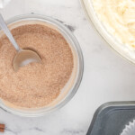 cinnamon and sugar in a bowl with a spoon.