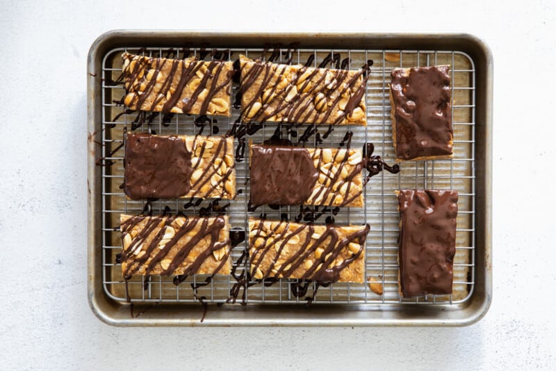 chocolate peanut butter granola bars on a cooling rack.