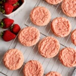 baked strawberry cookies on a wire rack.