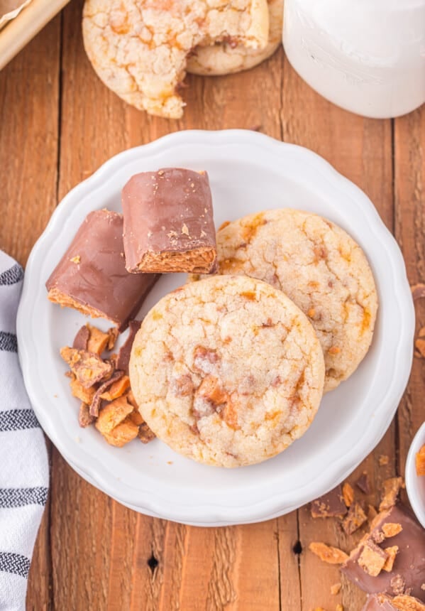 a plate with cookies and a glass of milk.