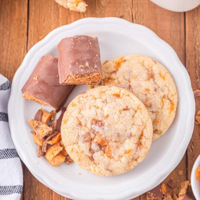 a plate with cookies and a glass of milk.