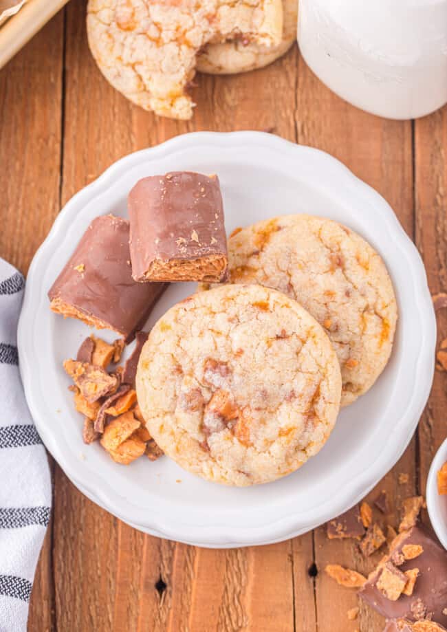 a plate with cookies and a glass of milk.