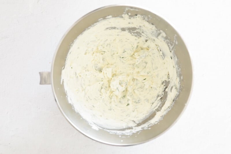 beaten cream cheese in a stainless mixing bowl.