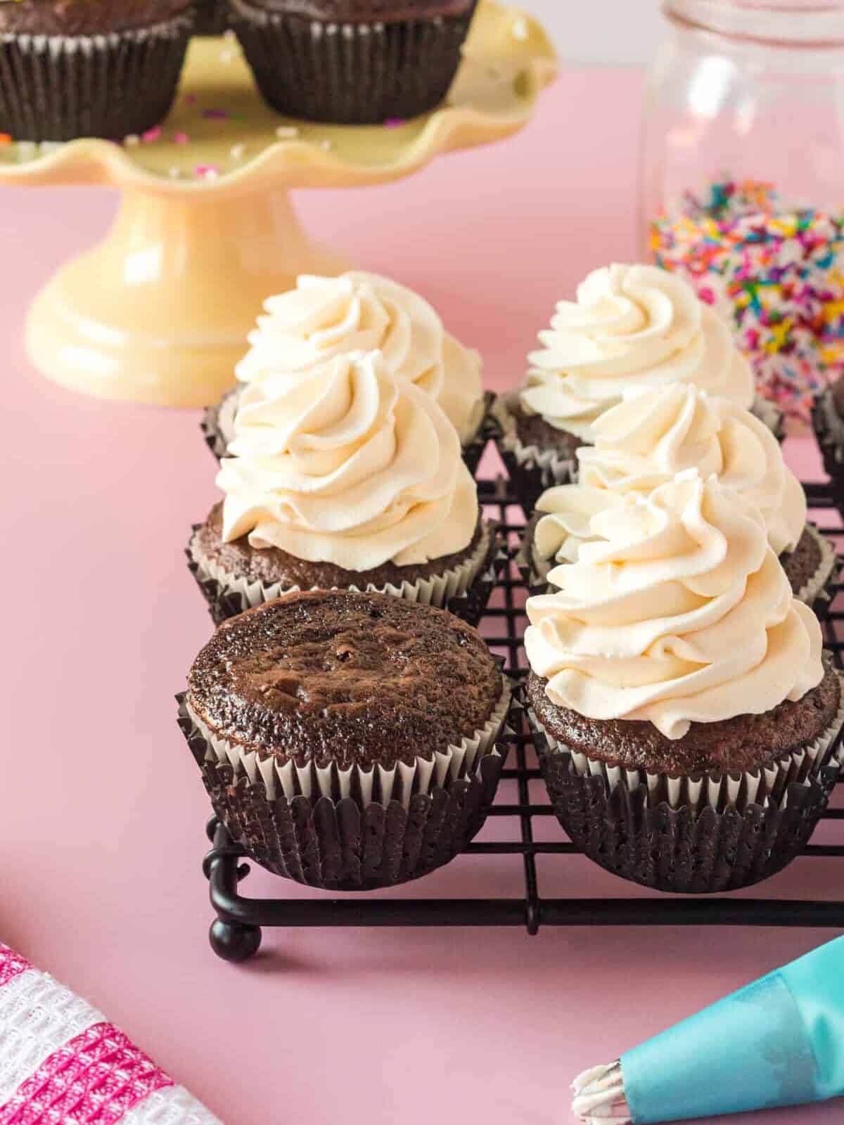 stabilized whipped cream on top of chocolate cupcakes