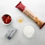 the ingredients for strawberry granola bars are shown on a white surface.