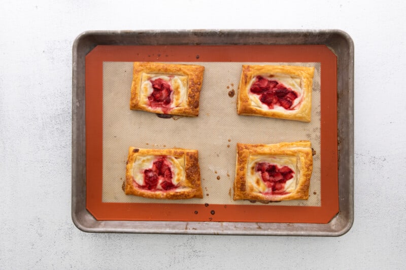 strawberry tarts on a baking sheet.