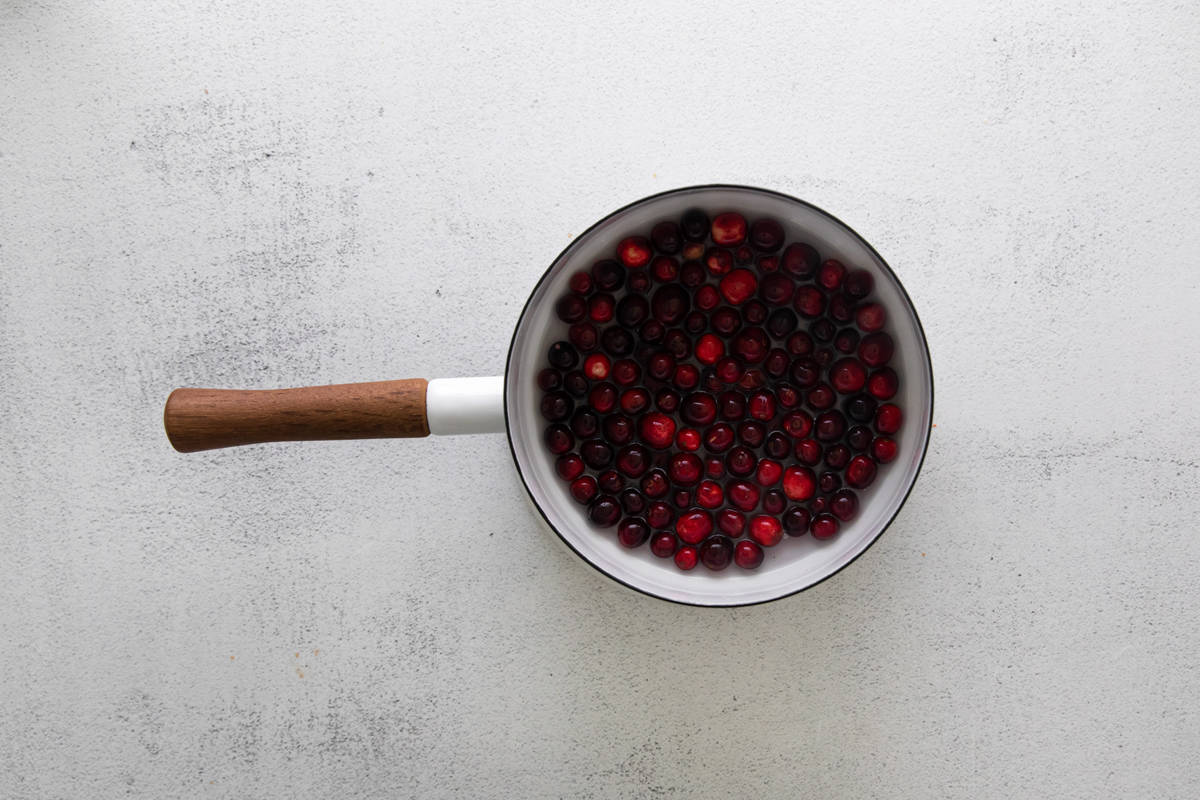 cranberries cooking in a saucepan