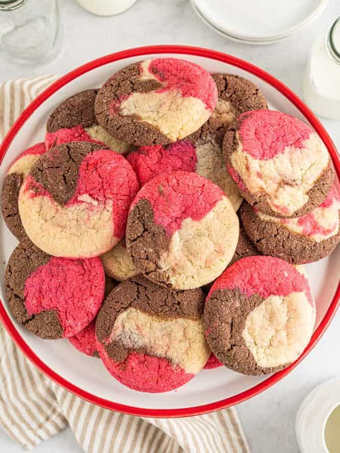 overhead view of a platter of chocolate, vanilla, and strawberry Neapolitan cookies