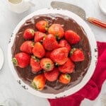 a chocolate cake with strawberries on top.