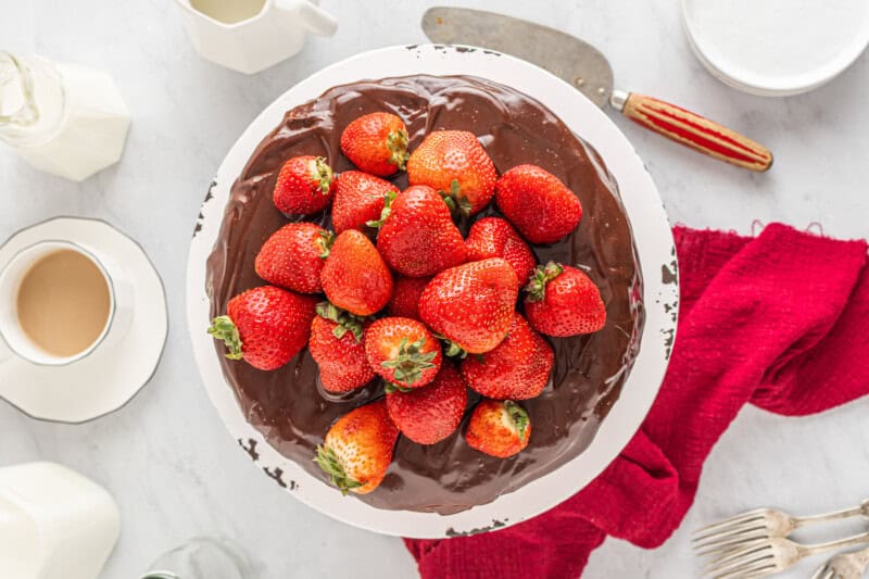 a chocolate cake with strawberries on top.