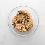 chocolate chip peppermint cookie dough in a glass bowl.