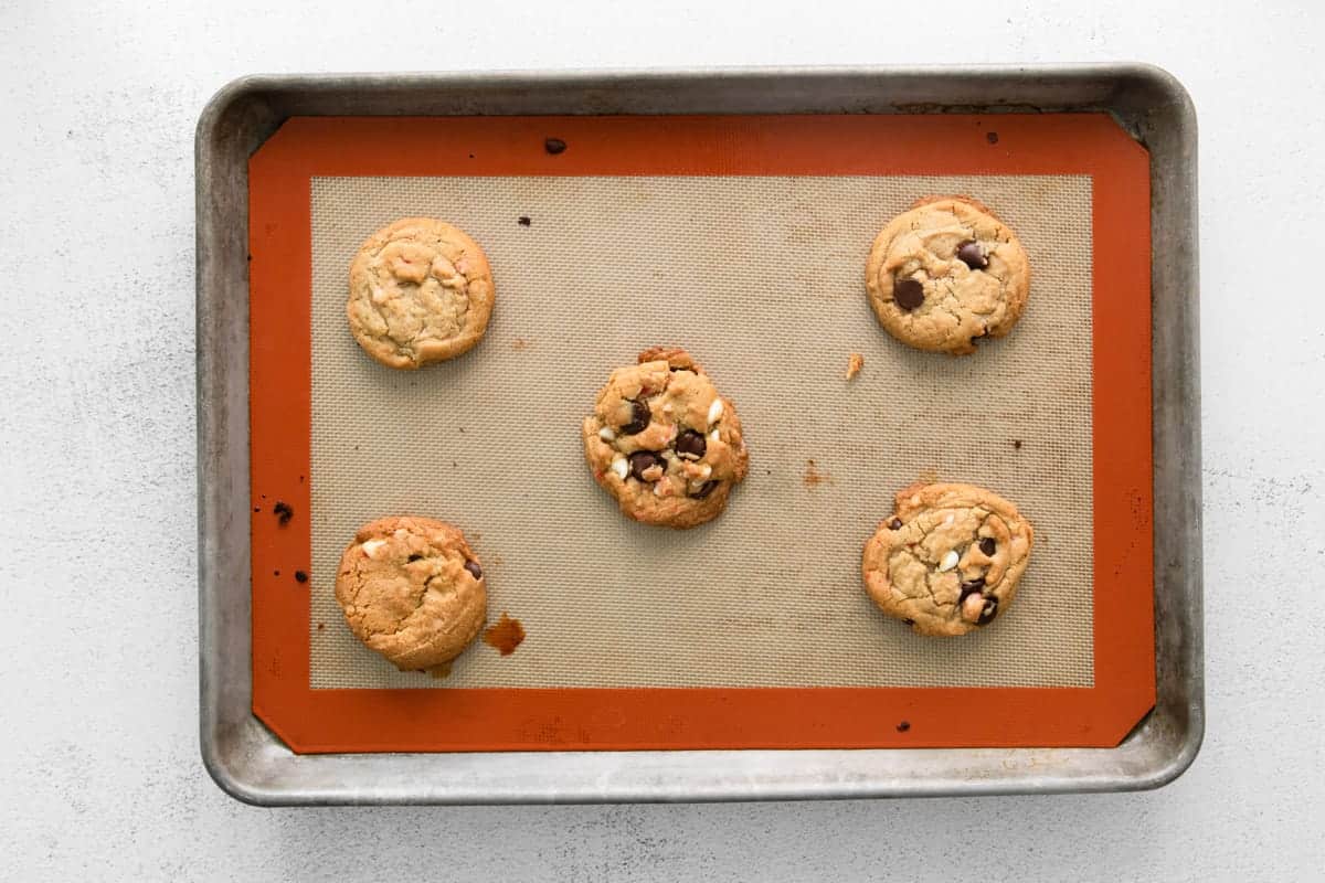 baked chocolate chip peppermint cookies on a baking sheet.