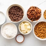 overhead view of ingredients for turtle bars in individual bowls.