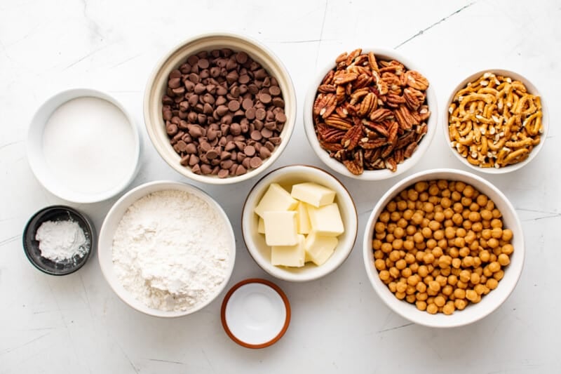 overhead view of ingredients for turtle bars in individual bowls.